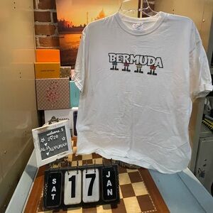 Vtg Bermuda graphic T-shirt featuring tiki figures.